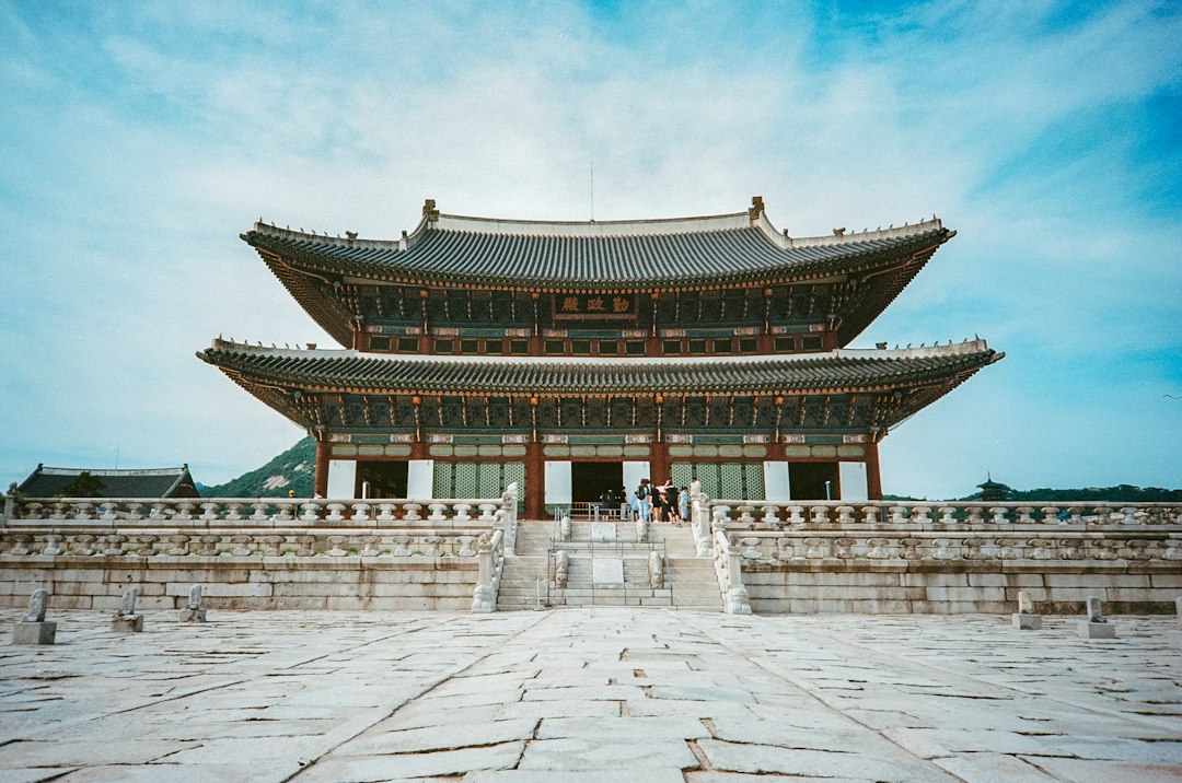 Geunjeongjeon Hall, the main throne hall of Gyeongbokgung Palace, under a blue sky
